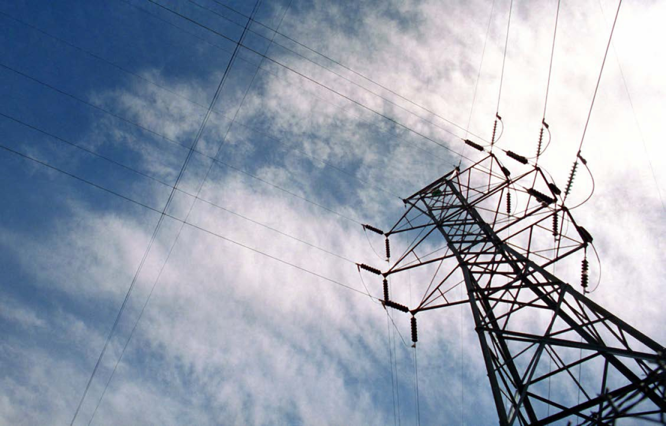Close-up of an electrical transmission tower.