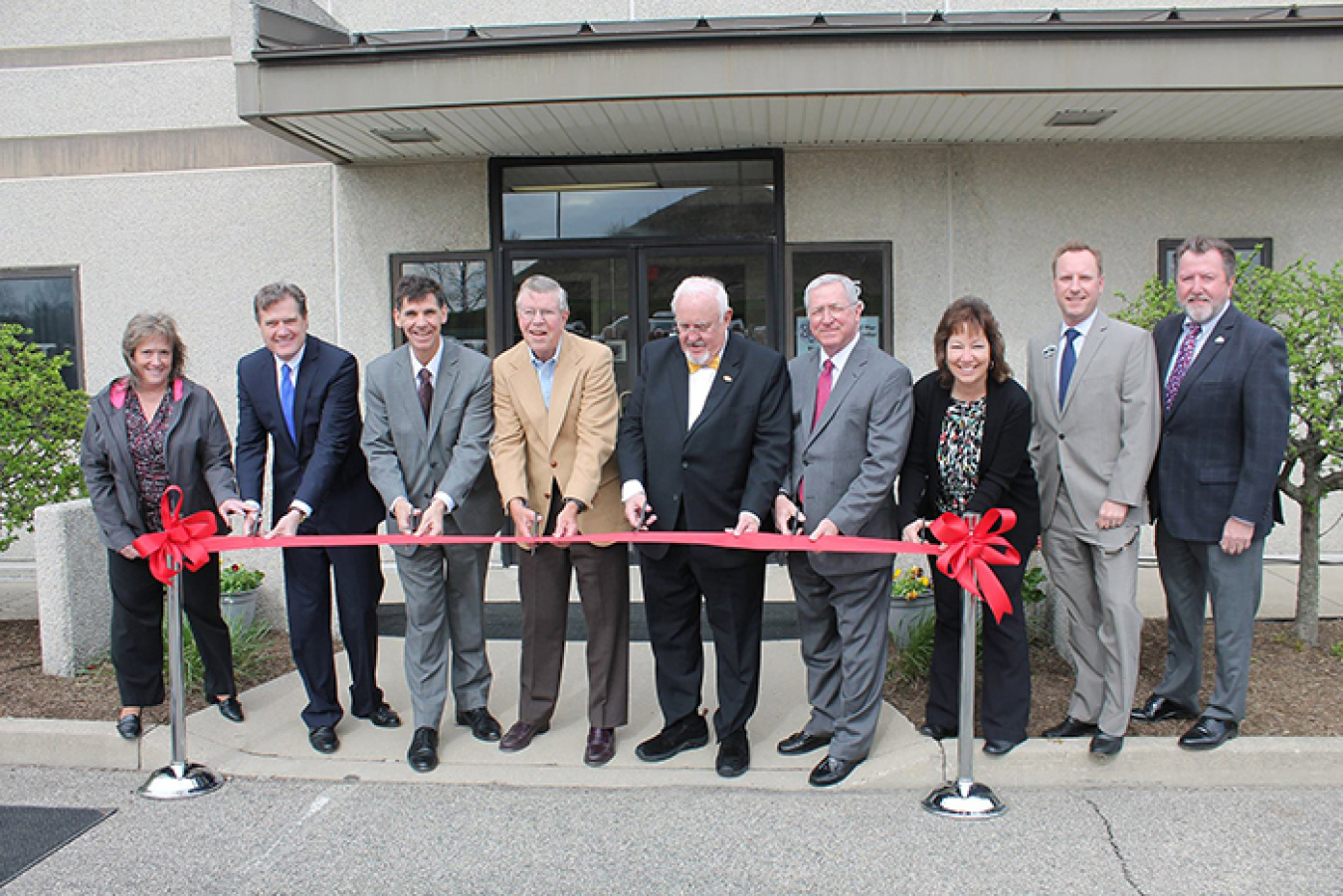 Officials cut the ceremonial ribbon to mark the opening of the Mound Cold War Discovery Center.