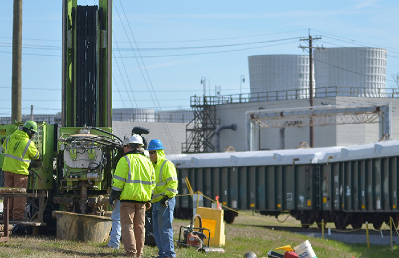 Drill rig operators prepare to retrieve a sample to be used to determine the location of the wells to optimize pump-and-treat operations at the Paducah Site’s northeast plume.