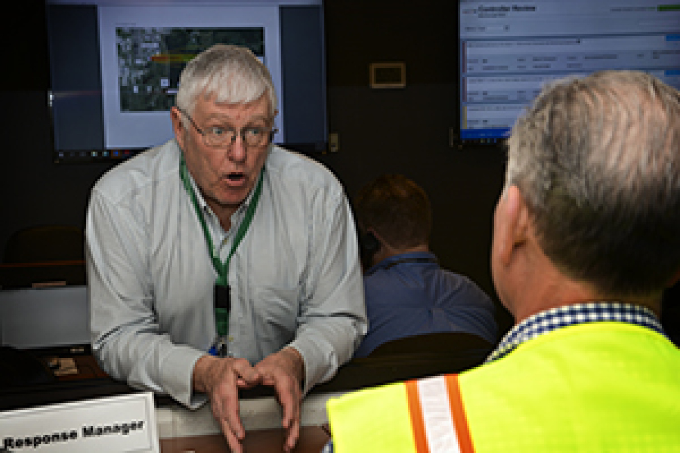 Fluor-BWXT Portsmouth’s Bernard Carrick, left, takes part in a recent emergency exercise at the Portsmouth Site’s Emergency Operations Center, which has been upgraded as part of the site’s emergency preparedness activities.