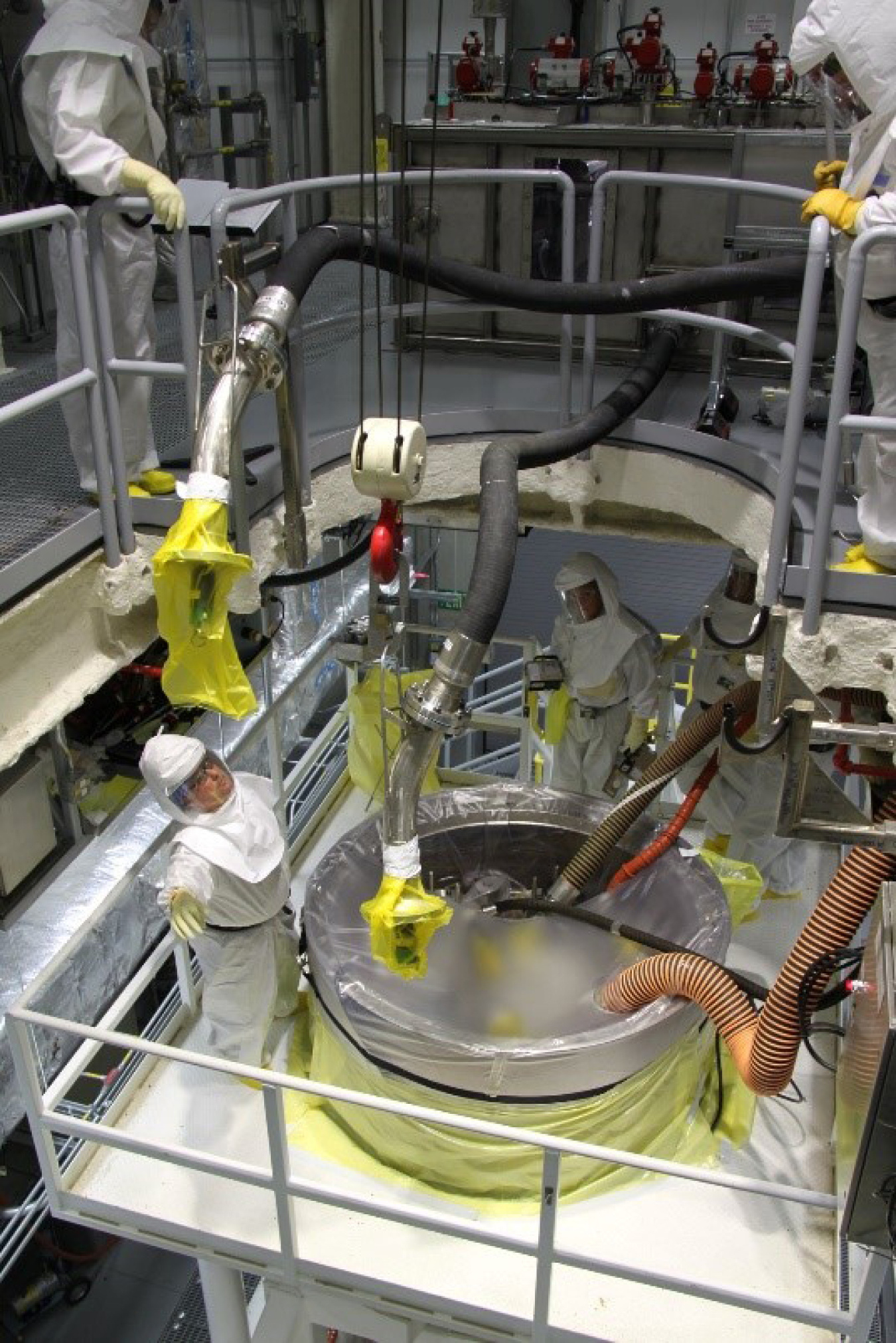 Workers on the sludge removal project step through procedures in the 100 K Reactor Area to prepare for a DOE operational readiness review completed in April.
