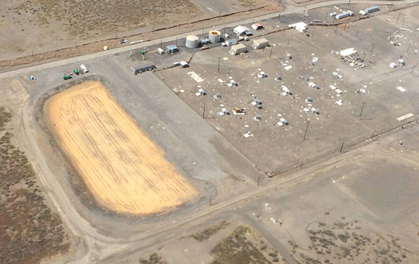Workers recently finished the SX Farm evapotranspiration basin, shown in light brown. It will collect and evaporate water drained from new interim surface barriers to be installed later this spring over Hanford’s SX Tank Farm, shown at the right.