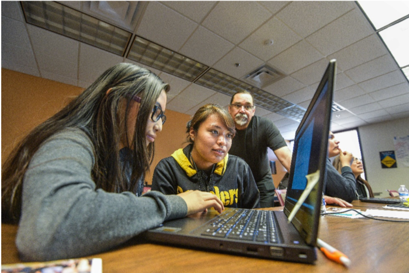 Students work at Sandia National Laboratories on a STEM project.