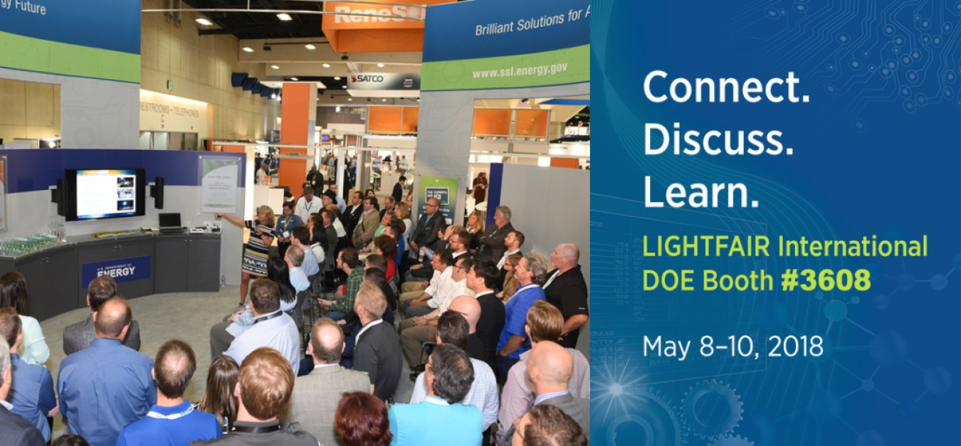 Photo of a crowd of people watching a presentation.