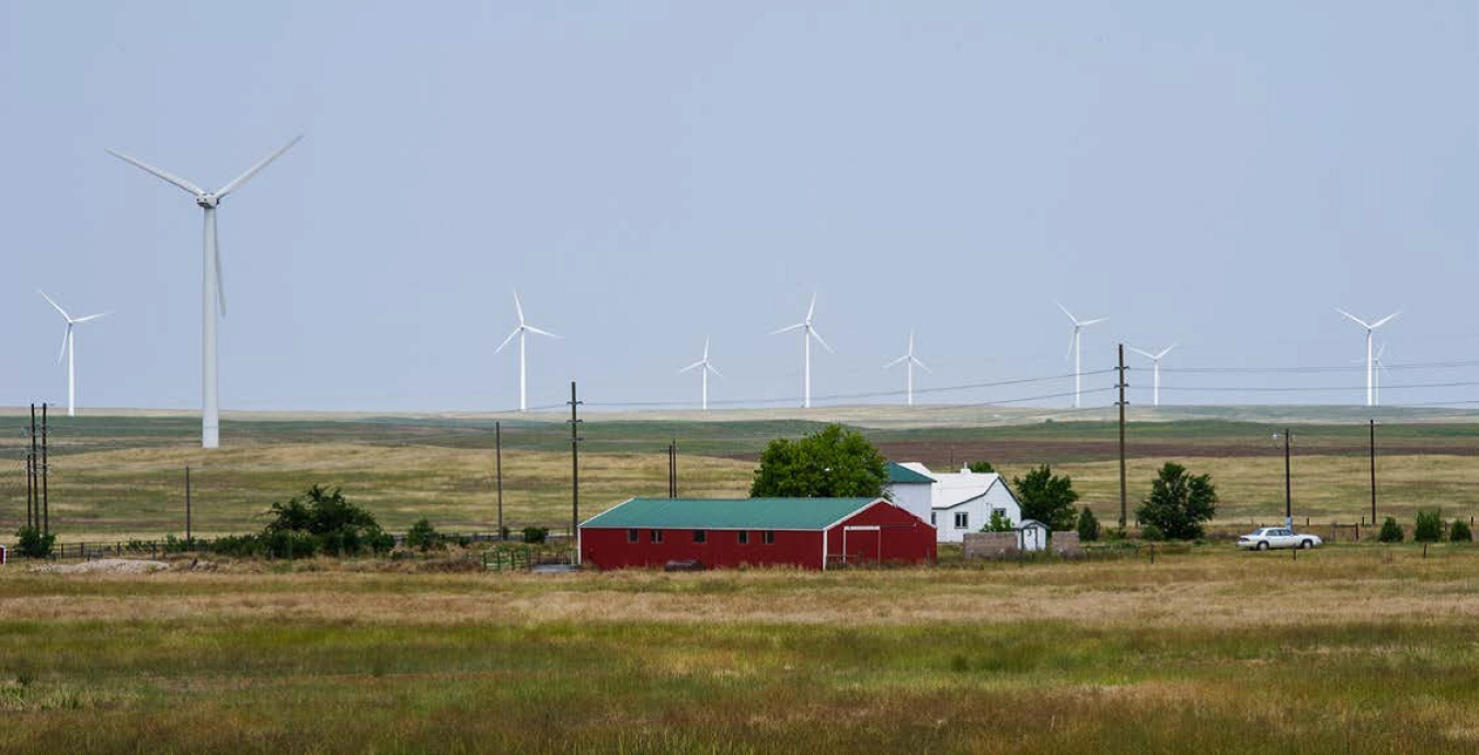 Farm with a wind turbine.