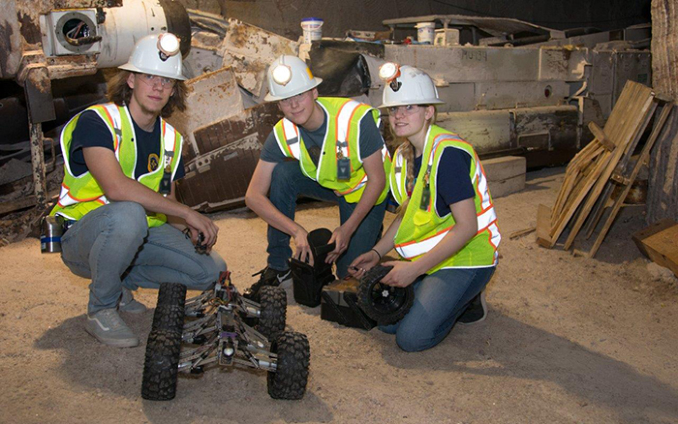 Left to right, Carlsbad High School science and engineering students Simon Armijo, Will Baggett, and Spencer Pennypacker test a robot in the Waste Isolation Pilot Plant underground in early May in preparation for an international robotics competition.