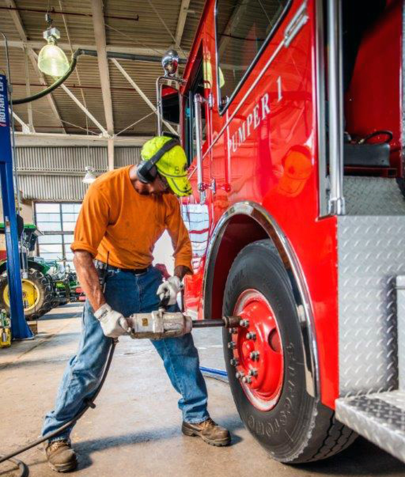 Swift & Staley Team Heavy Equipment Mechanic Bill Jackson performs maintenance on a Paducah Gaseous Diffusion Plant firetruck.