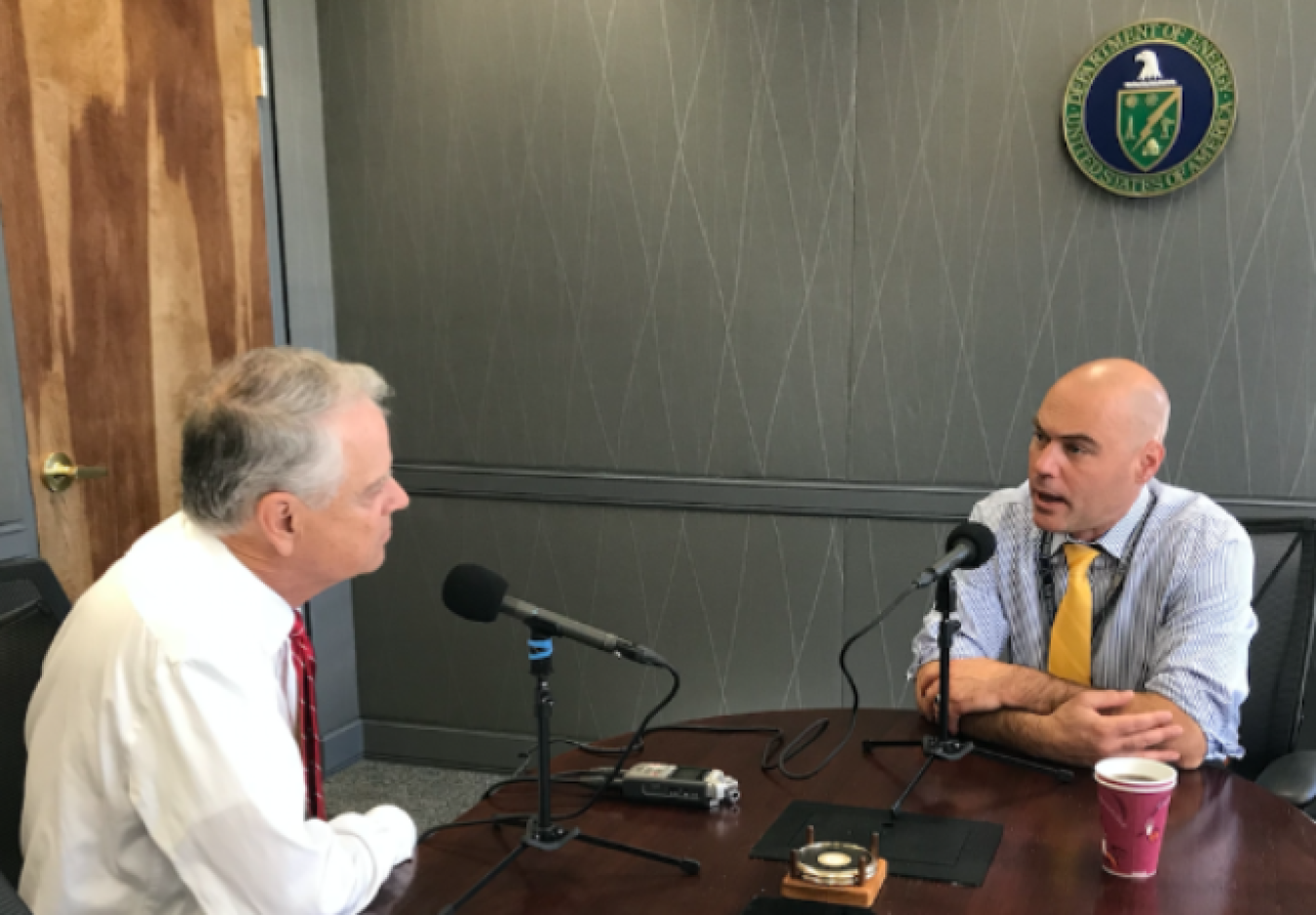 Photo of Bruce J. Walker being interviewed by Columbia Energy Exchange podcast host Bill Loveless