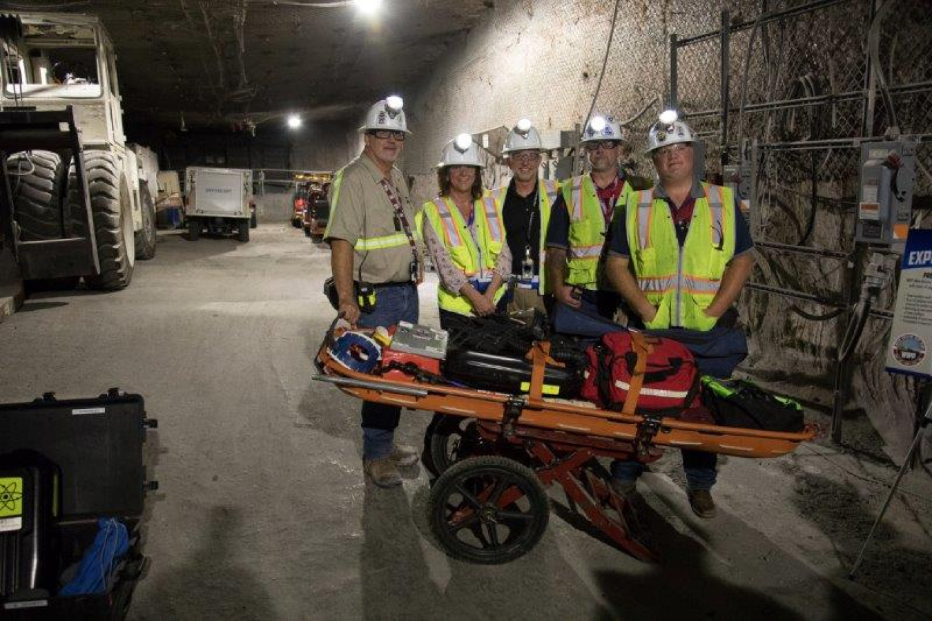 EM Assistant Secretary Anne White, second from left, stands with members of the 2016 Waste Isolation Pilot Plant National Champion Mine Rescue Team, including, from left, Tony Mihelic, Nuclear Waste Partnership President Bruce Covert, Mark Long Jr., and M
