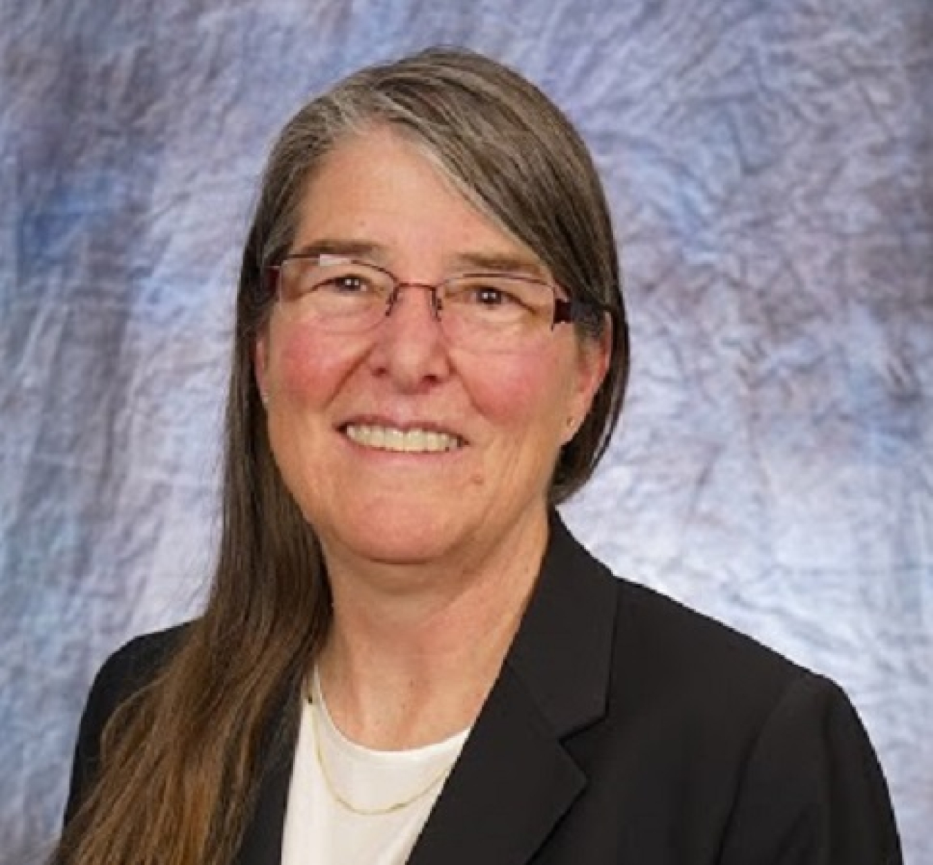 Head and shoulders shot of Marlys Kinsey, Business Services Director for the Golden Field Office.
