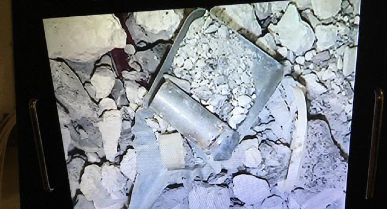 A view of radioactively contaminated concrete debris found inside one of 27 containers being processed at the former spent nuclear fuel hot cells at the Idaho Nuclear Technology and Engineering Center.