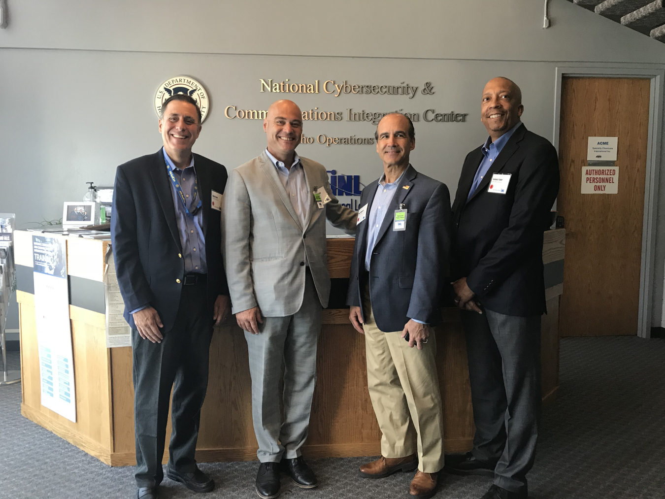 Photo of Under Secretary Mark Menezes, Assistant Secretary Bruce J. Walker, and two other particpants