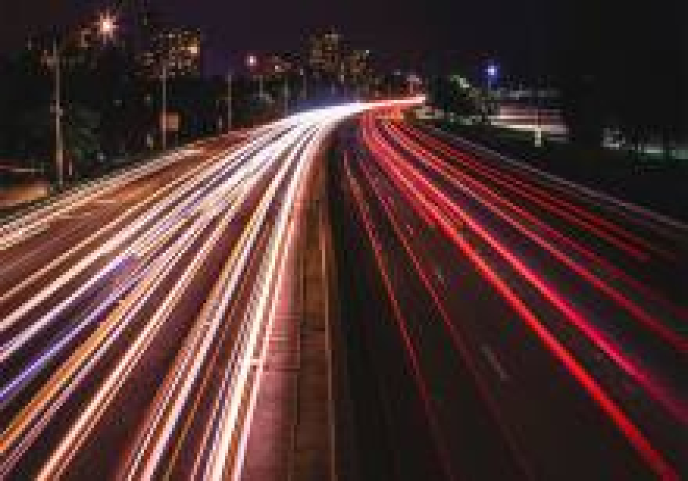 Photo of highway full of car lights.