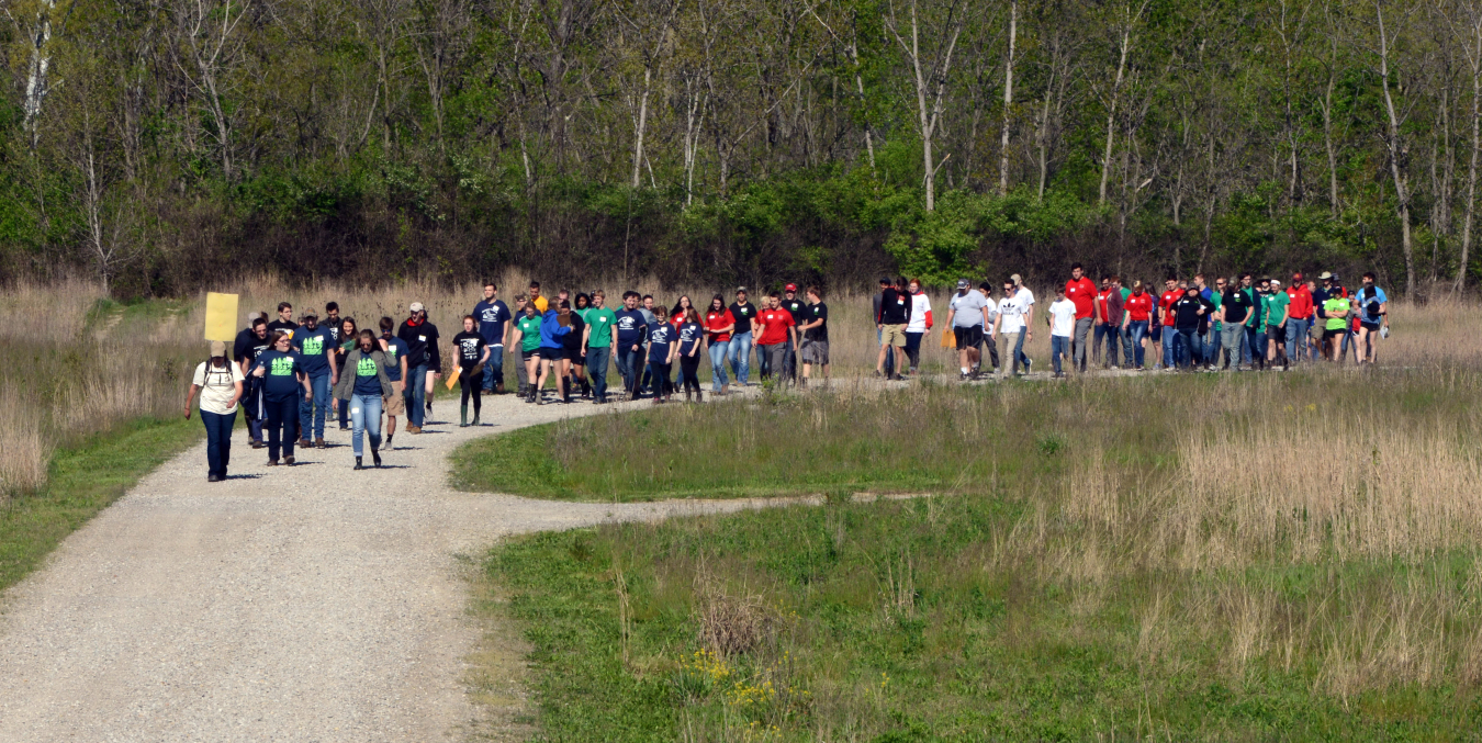 Envirothon students hike from one testing station to another.