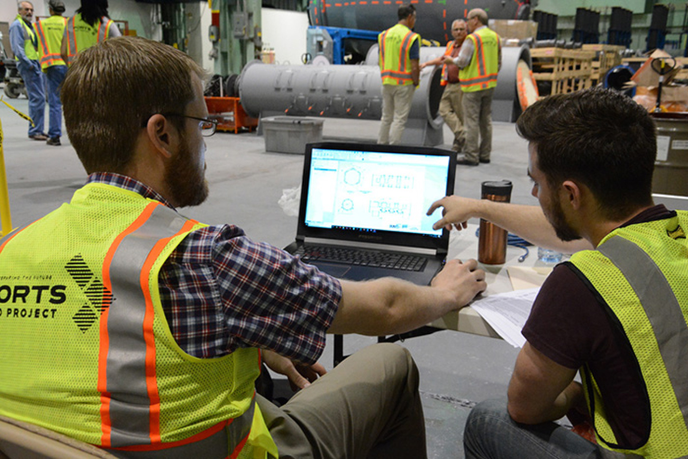 Carnegie Mellon University’s Ralph Boirum, left, and EM Fellow Michael DiBono evaluate data.