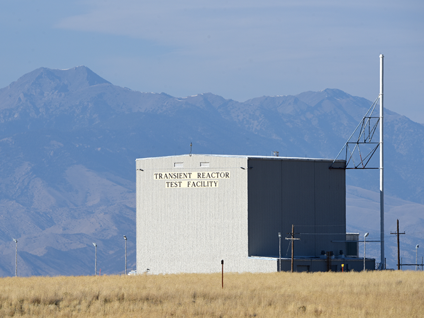 Exterior photo of a feature at the TREAT reactor, with mountains shown in the background.