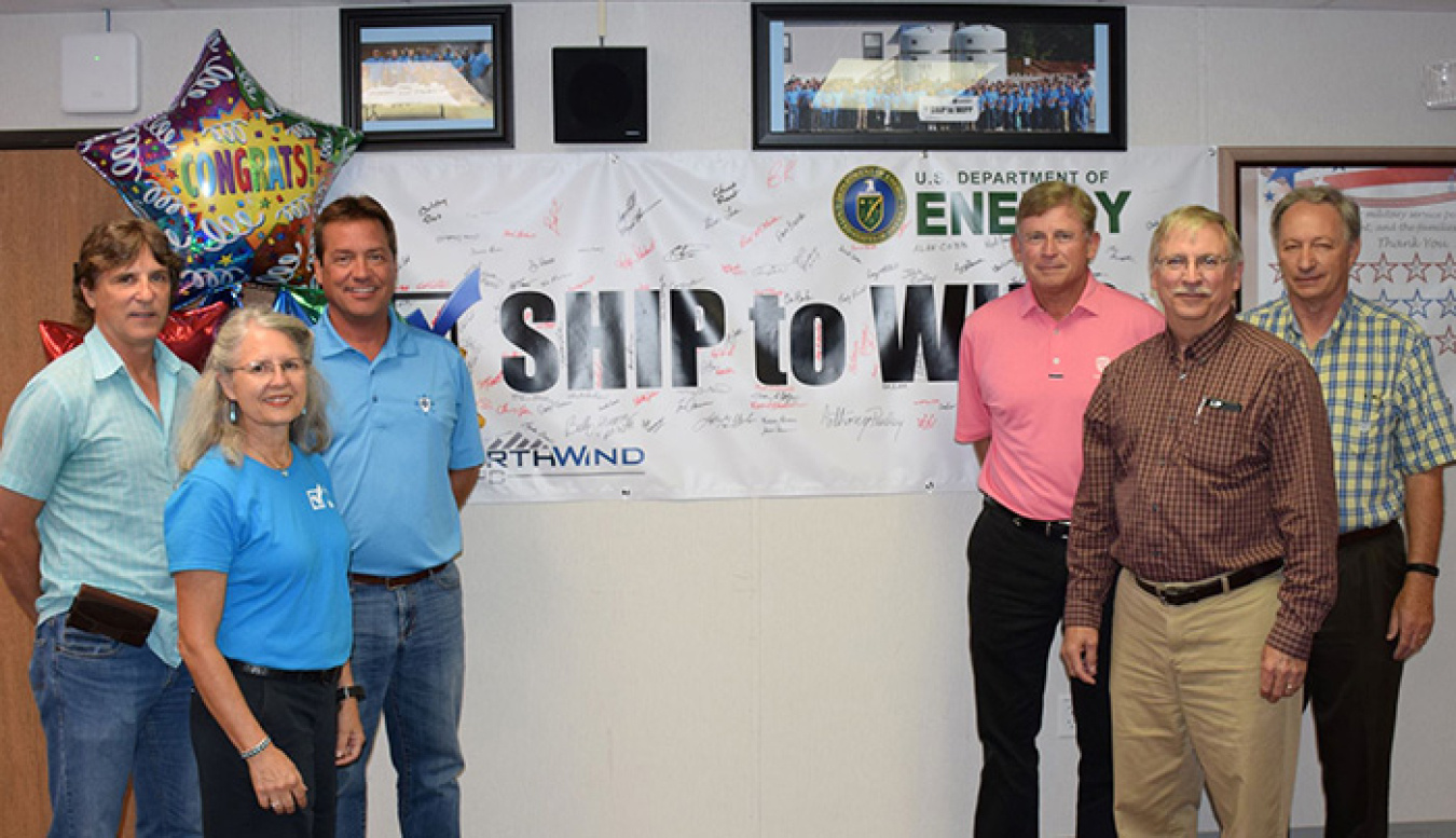 Employees gather to celebrate completing a full year of shipments to the Waste Isolation Pilot Plant.