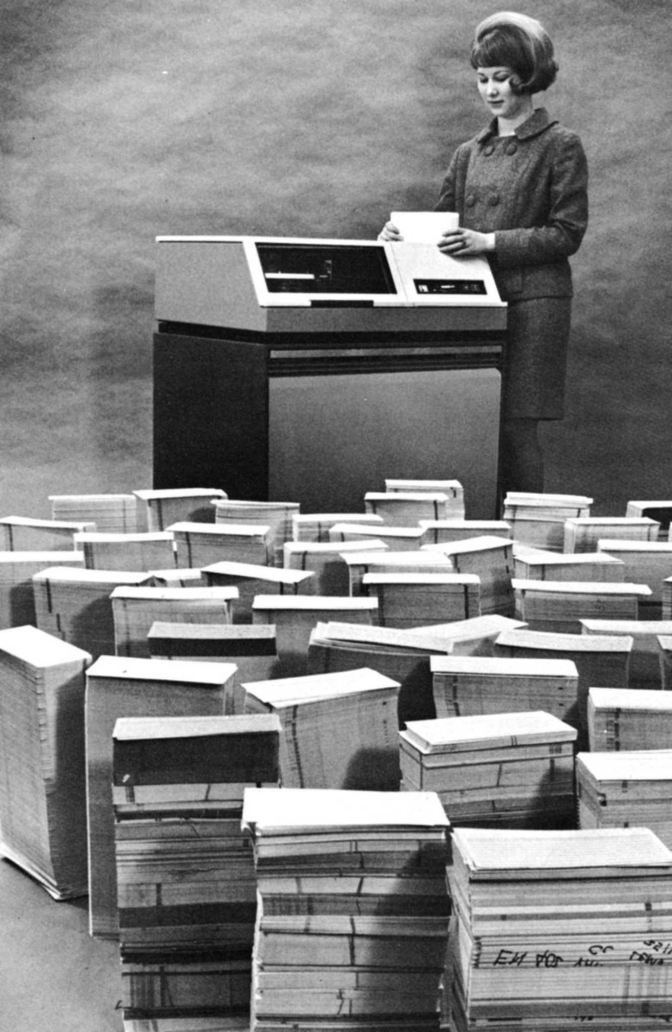 A Kansas City National Security Campus employee with disk drive and punch cards