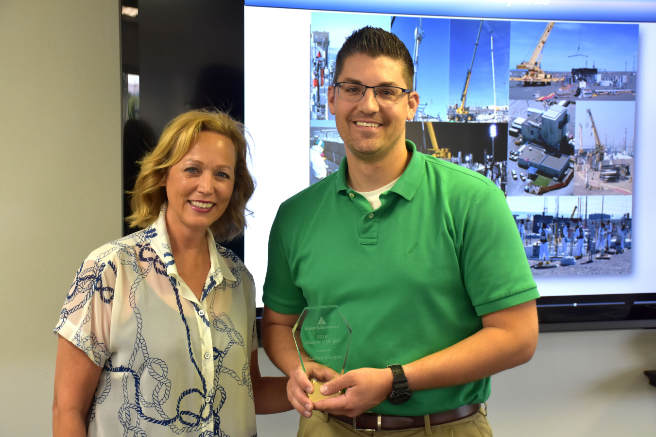 Nathan Morgan, a Washington River Protection Solutions project controls manager, stands with Junior Achievement regional director Susan Fillafer.