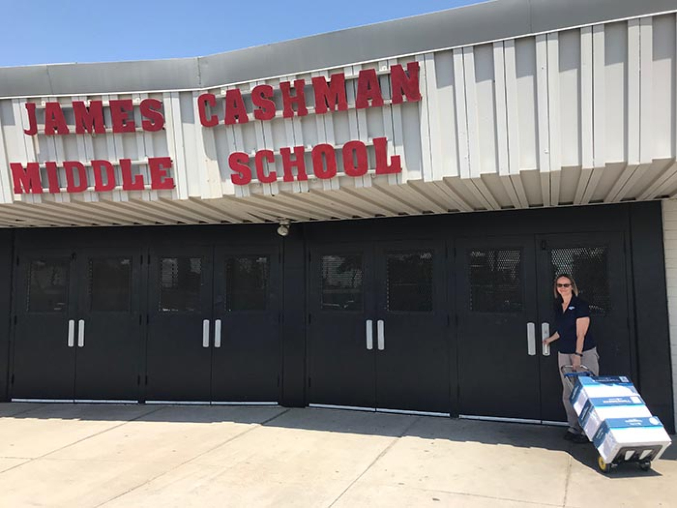 Nevada Site-Specific Advisory Board Administrator Barb Ulmer delivers the EM Nevada Program’s learning materials to James Cashman Middle School in Las Vegas.