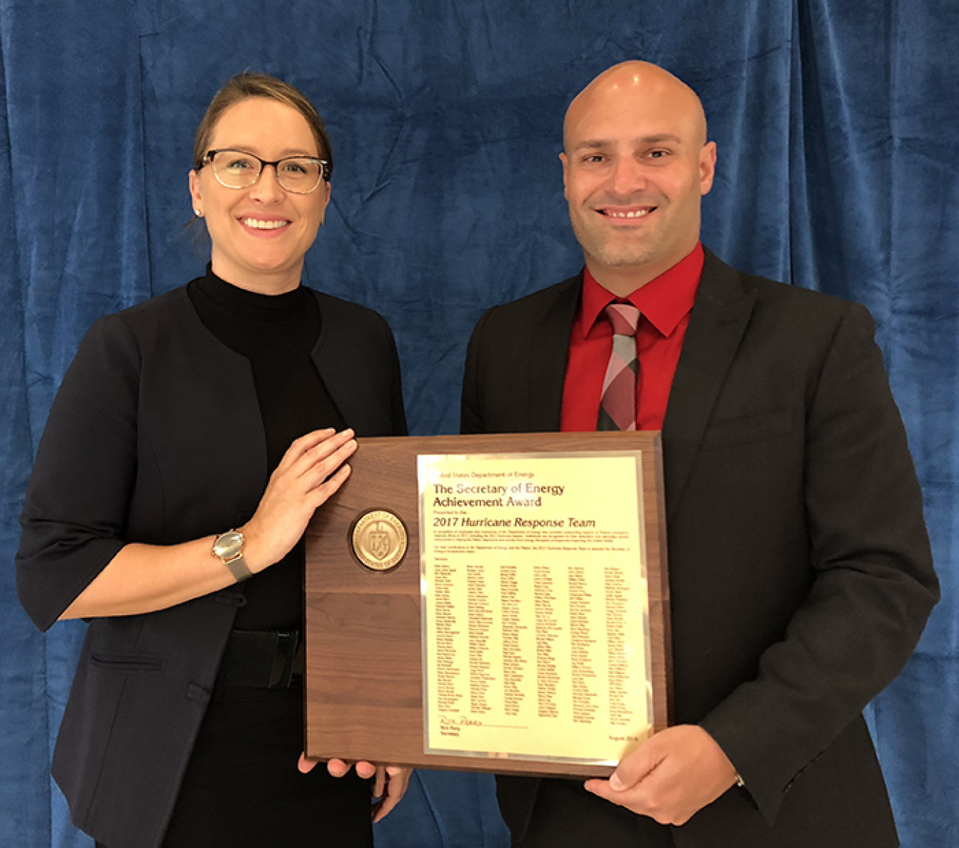 EM Program Analyst Crystal Williams and EM Technology Development Office Program and Project Manager Jean Pabón hold the Secretary of Energy’s Achievement Award for the 2017 Hurricane Response Team.