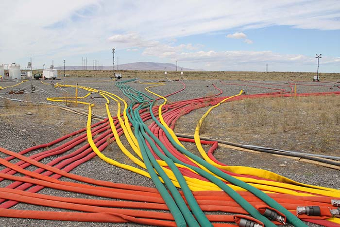 A network of brightly colored hoses supply 48 injection wells with a solution to bind with uranium in the ground on the Hanford Site, preventing the contaminant from reaching groundwater and the nearby Columbia River.