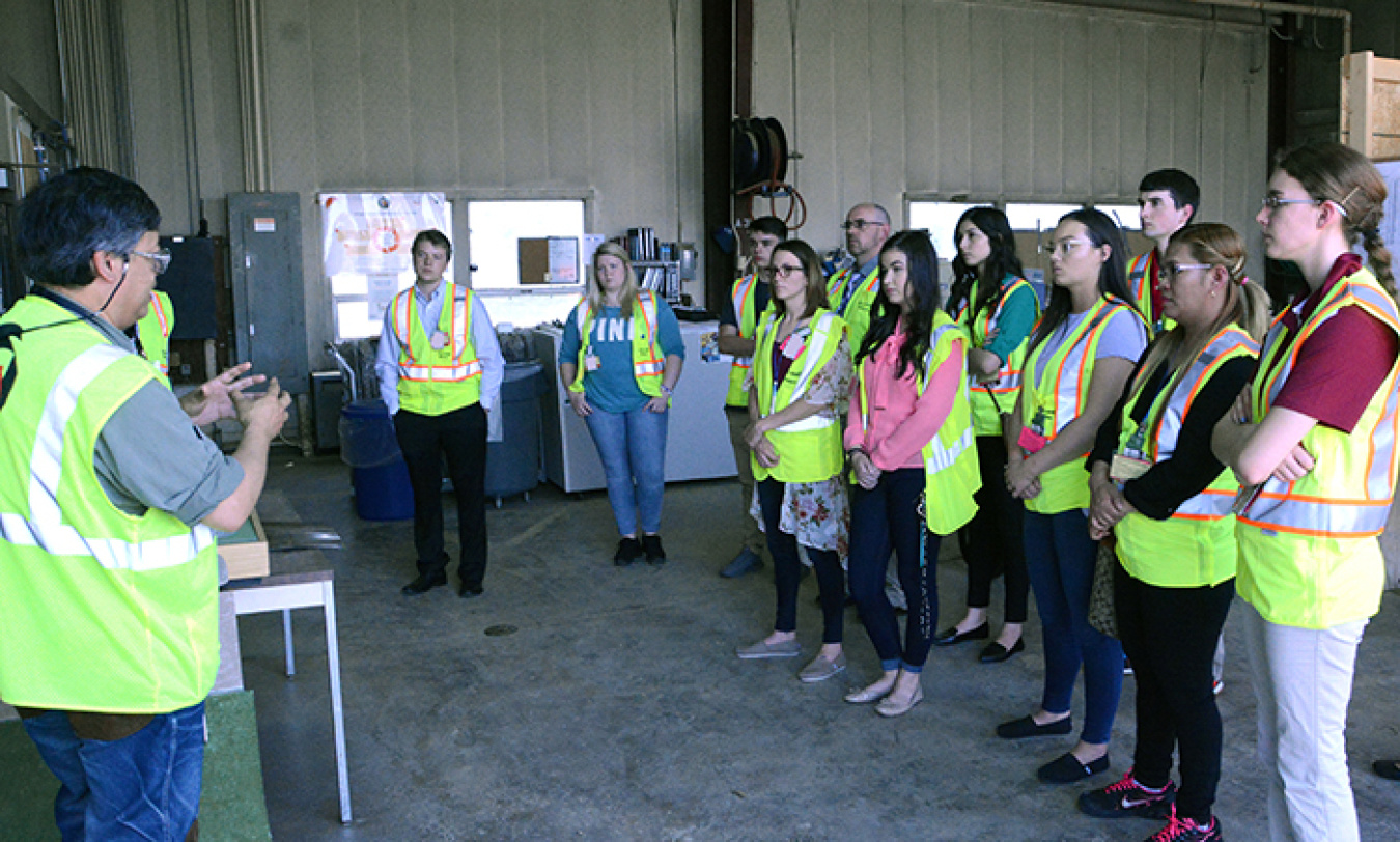 Fluor-BWXT Portsmouth (FBP) welcomed new college interns this summer with a site tour. FBP’s Dr. J.D. Chiou, left, provides an overview of the OnSite Waste Disposal Facility under construction at the Portsmouth Site.