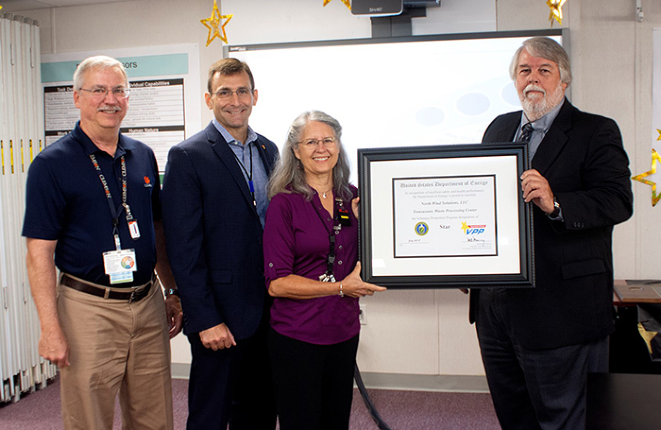 Oak Ridge officials stand with the DOE Voluntary Protection Program Star Site Award.
