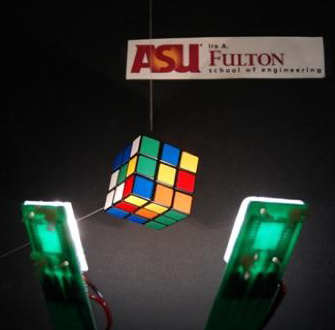 Photo of white OLEDs illuminating a Rubik’s cube.