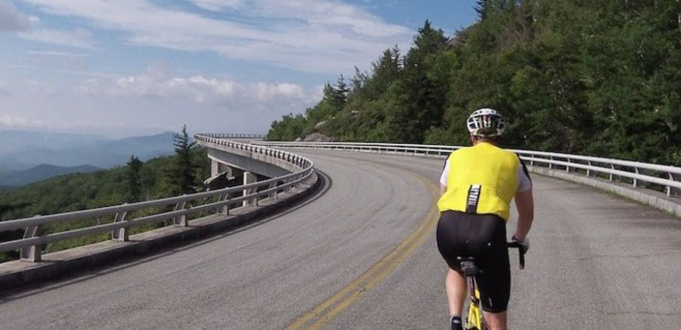 Cyclist riding through the Blue Ridge Parkway.