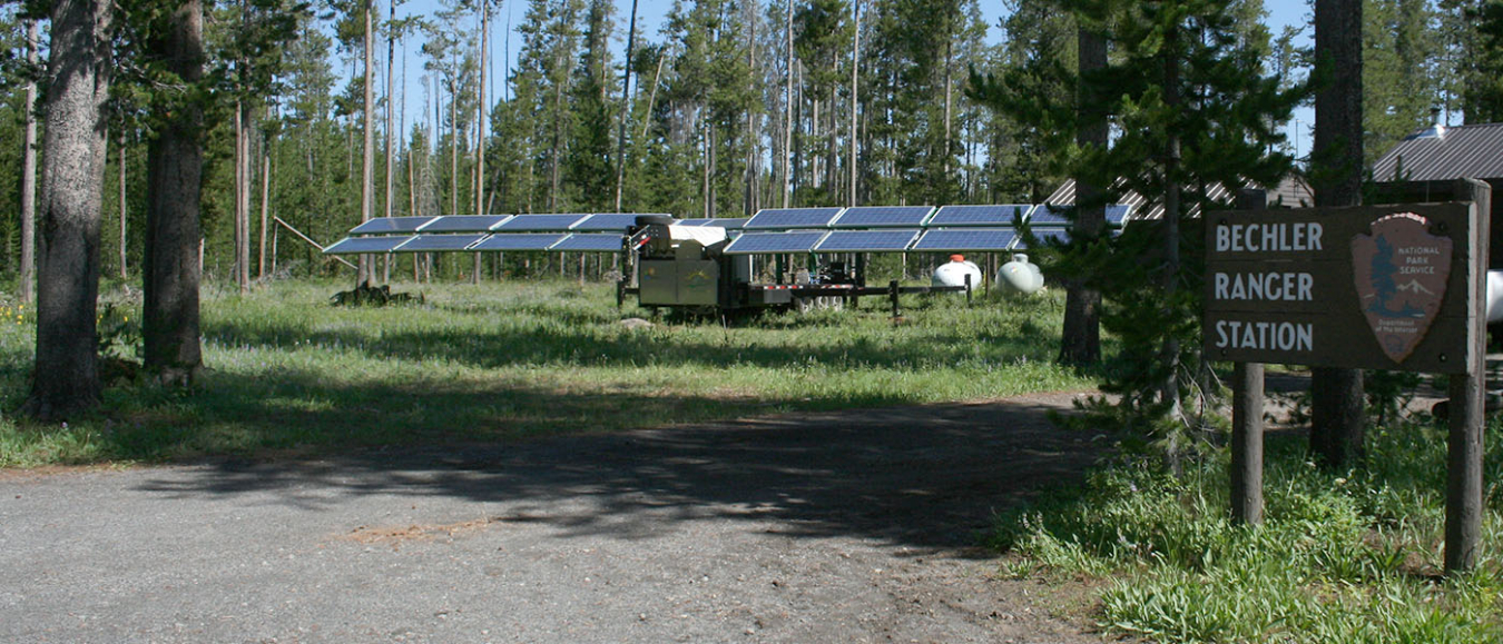 Solar panels set up in the woods of Yellowstone National Park.