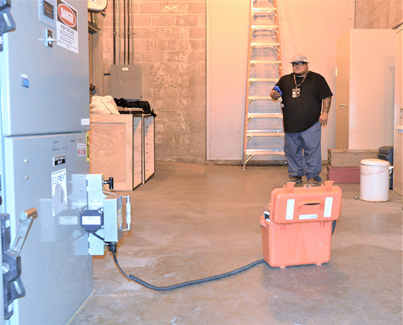 Michael Mendoza, a stationary operating engineer with Hanford contractor Mission Support Alliance, demonstrates a new remote switch used by the water and sewer utilities division.