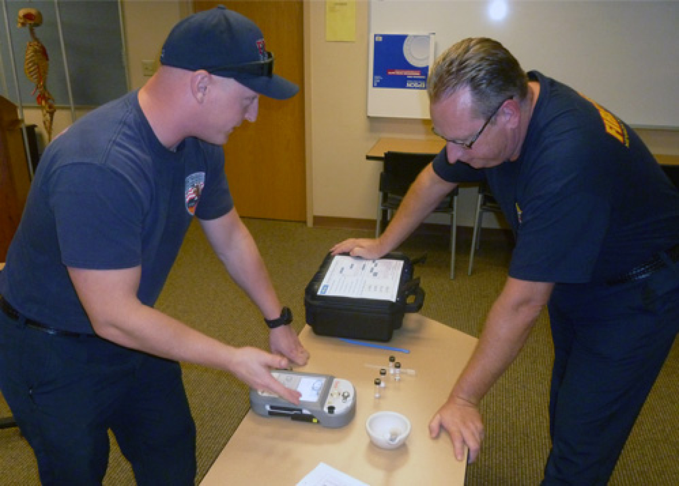 Nevada National Security Site fire and rescue personnel with handheld chemical analyzers that use infrared technology.