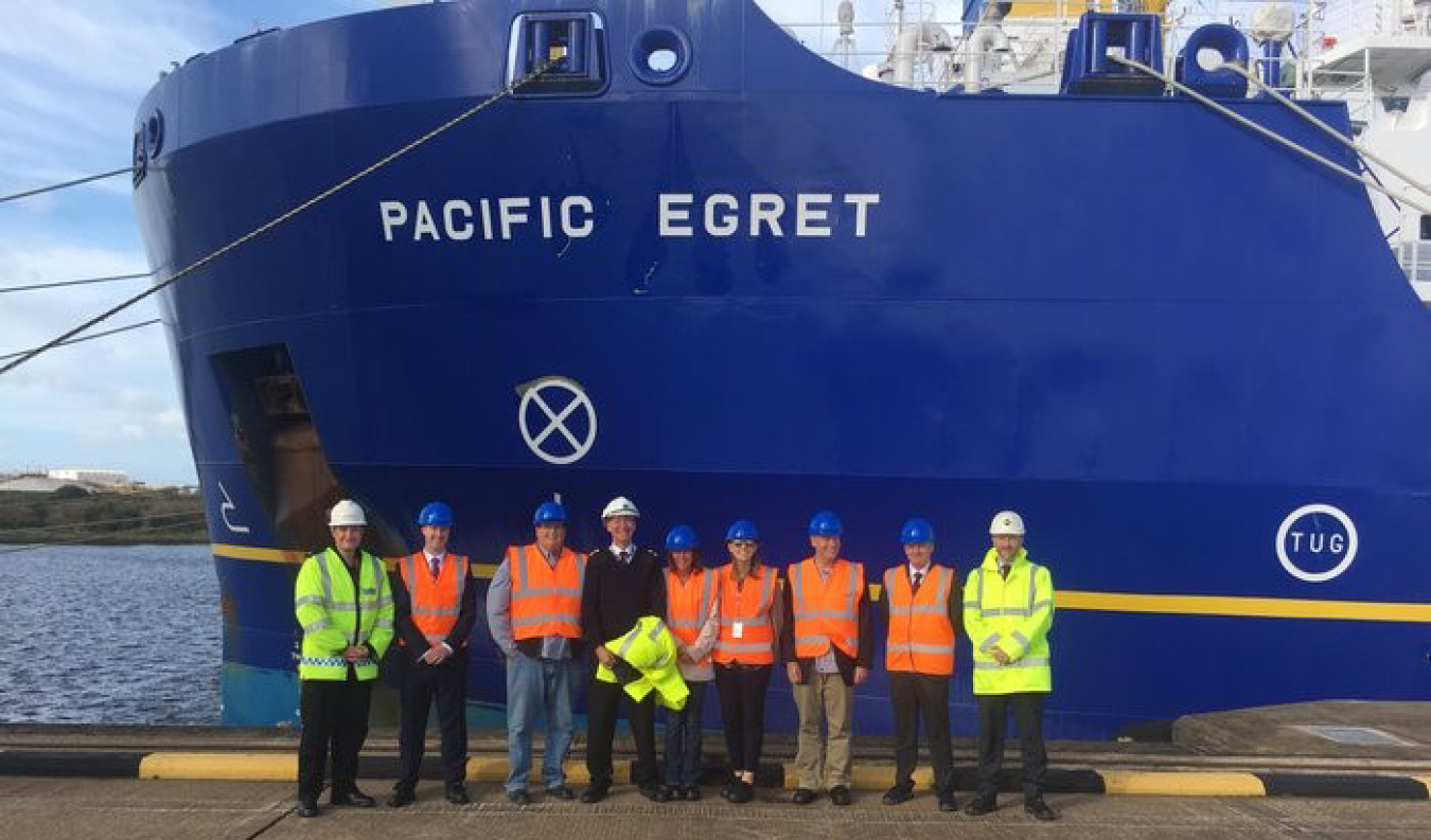 EM Assistant Secretary Anne White, center, and other members of the DOE delegation toured the Pacific Egret.