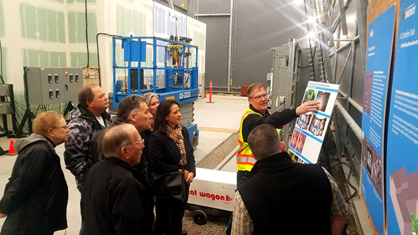 Mike Douglas, deputy vice president of the CH2M HILL Plateau Remediation Company 324 Building Disposition Project, explains to Hanford Communities members how the mock-up helped identify and resolve issues prior to equipment installation at the 324 Bldg.