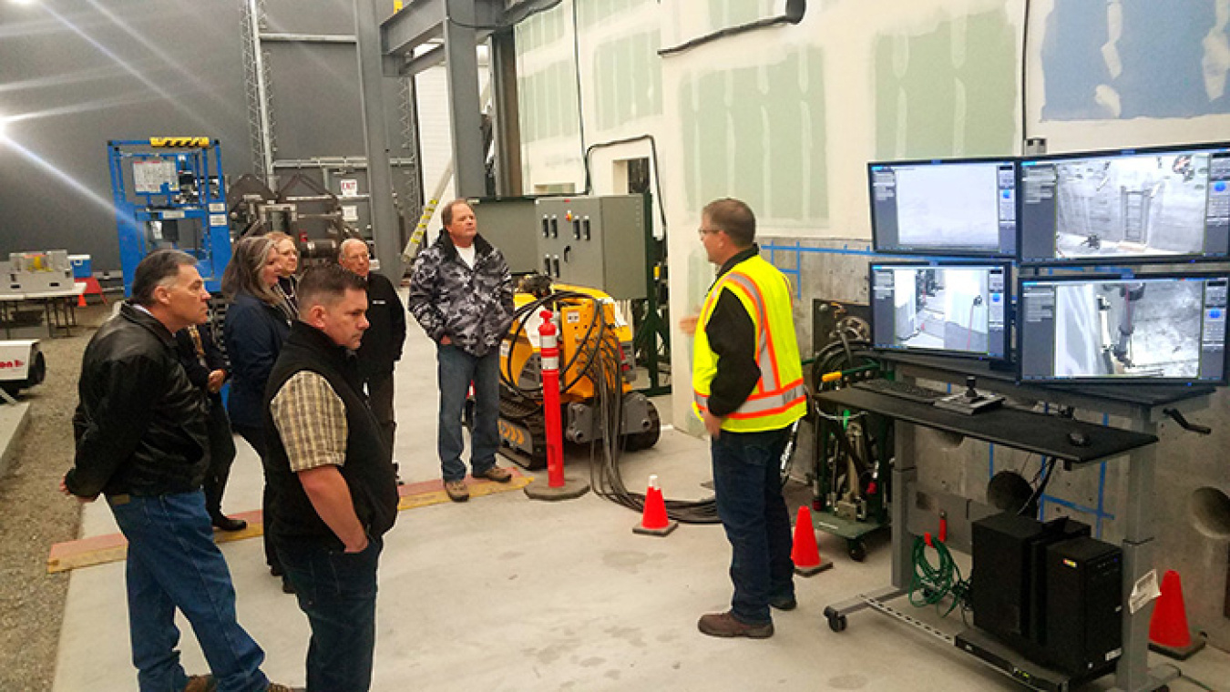Richland Operations Office employees give Hanford Communities members a tour of the mock-up, which is intended to increase safety and worker confidence, providing employees with the opportunity to work in a non-hazardous environment.