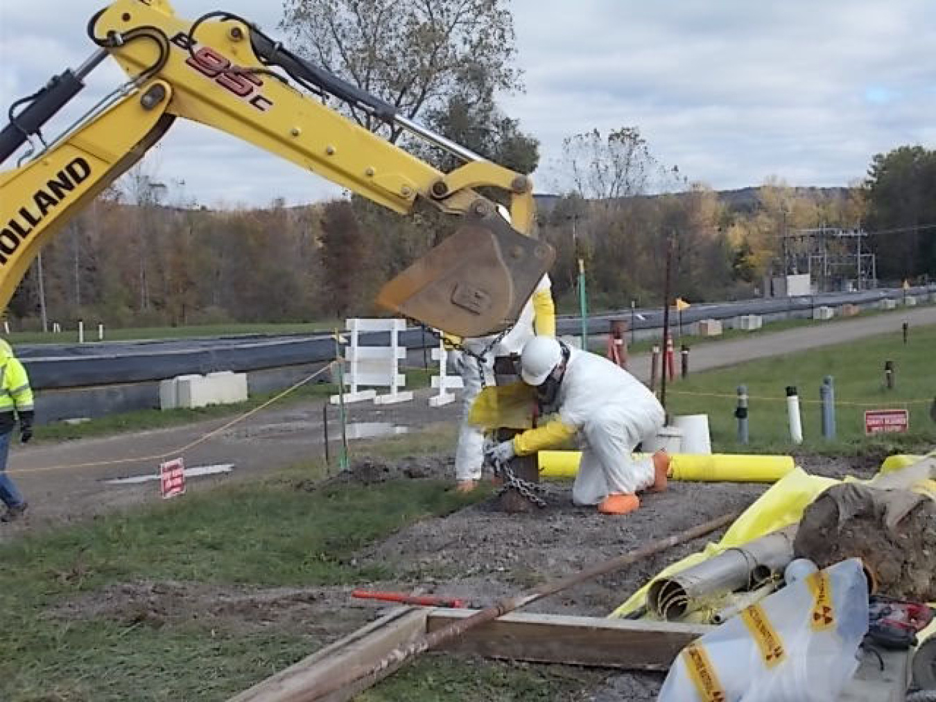 Workers prepare to remove a well pump from a former pump-and-treat system at EM’s West Valley Demonstration Project site.