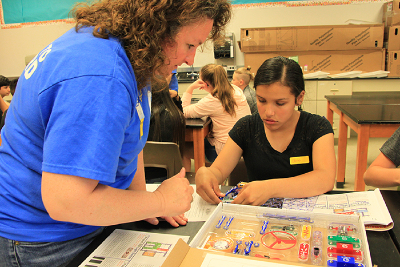 Students use circuit boards to learn to follow instructions in a STEM Like ME! activity with mentor Tonya Bean, an industrial hygienist from the Hanford Site.