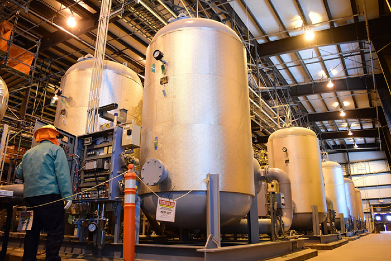A Waste Treatment and Immobilization Plant employee inspects electrical control equipment in the Chiller Compressor Building, which was recently turned over for startup and testing. 