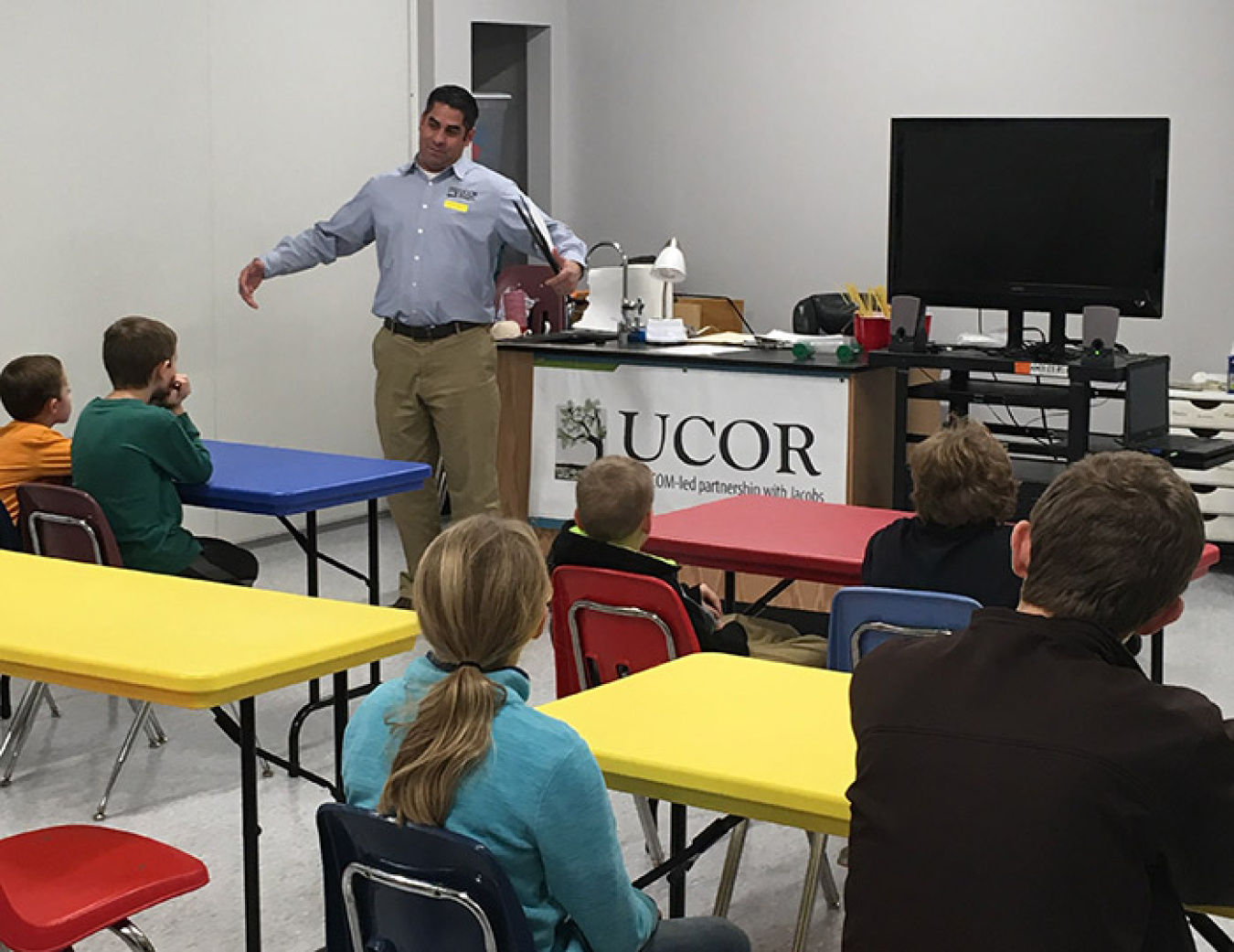 UCOR Deputy Waste Disposition Manager Clint Mori talks with students at Family Science Saturday about how he uses engineering solutions in his job.