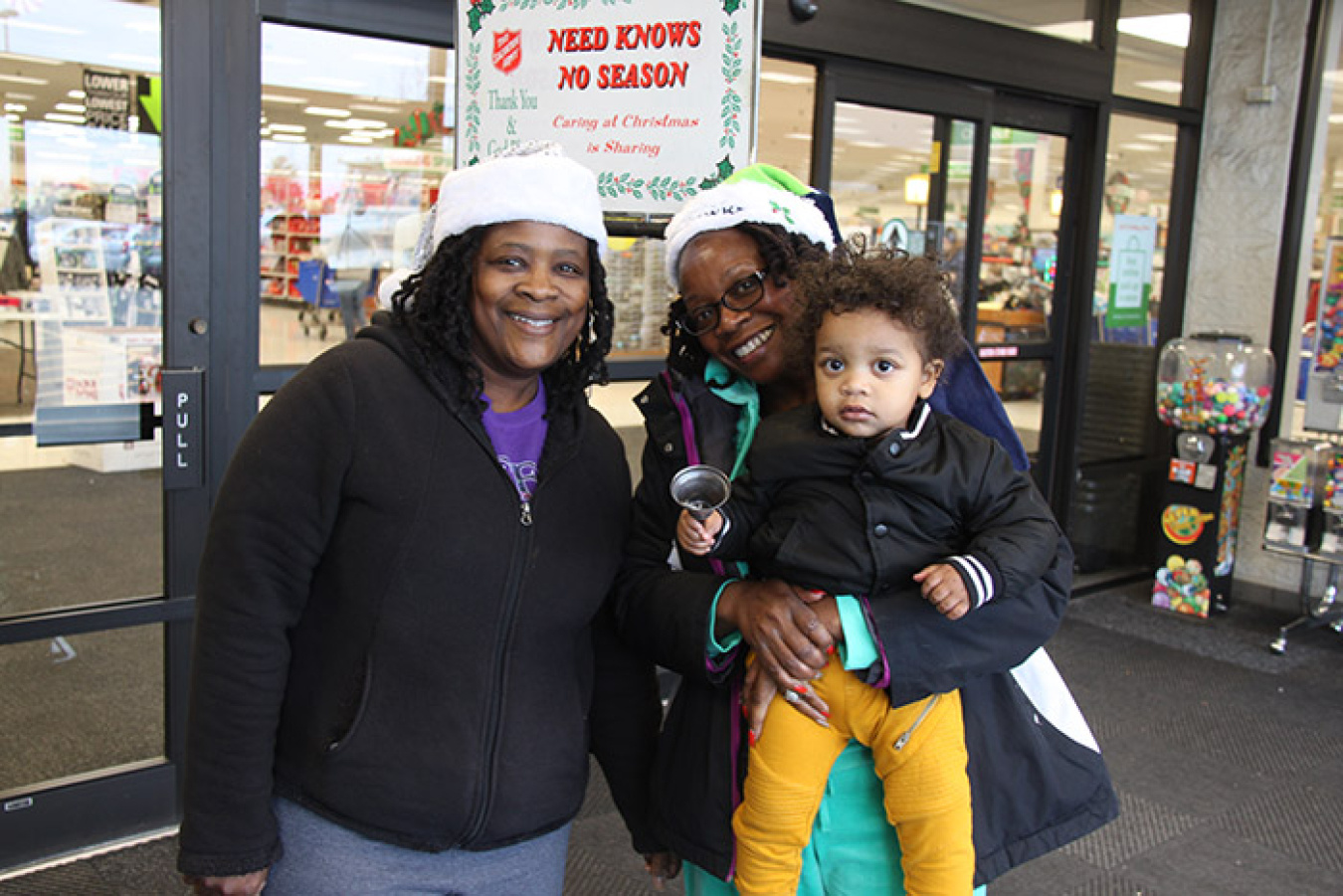 Dorothy Dunbar, CH2M HILL Plateau Remediation Company, left, and her sister, Benjie Allen, with their great-nephew, Isaiah, participated in this year’s Salvation Army Red Kettle campaign.