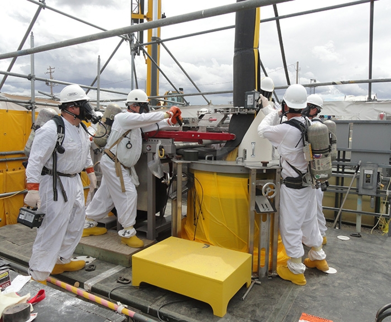 Washington River Protection Solutions employees remove a failed pump from double-shell tank AW-106.