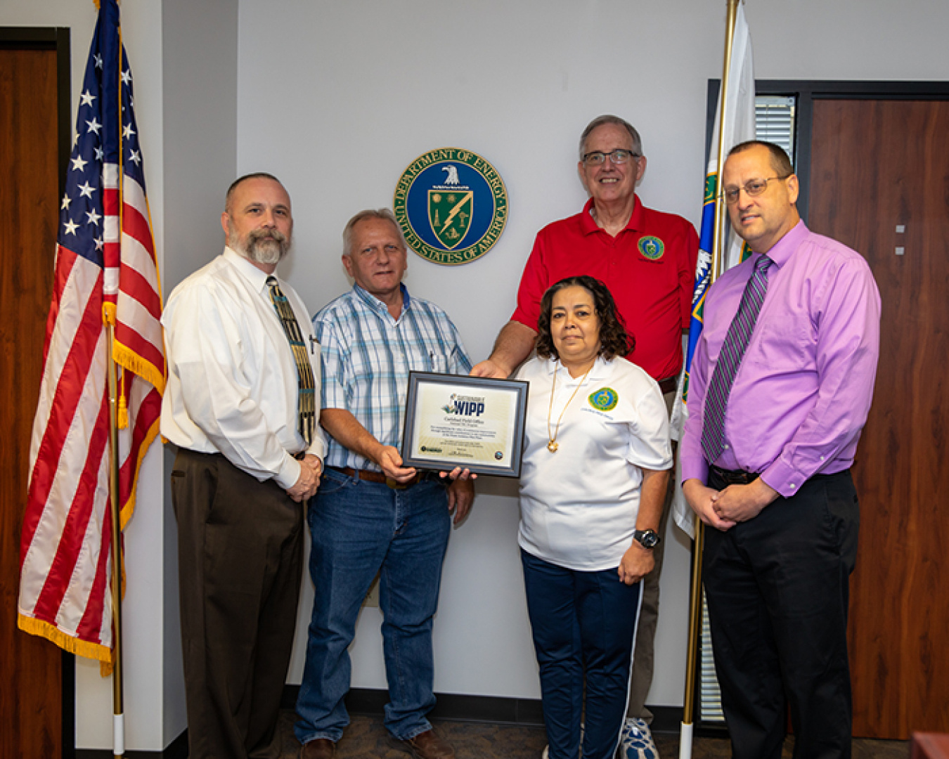 The Carlsbad Field Office (CBFO) presented Waste Isolation Pilot Plant sustainability awards to CBFO employees. From left are Kenneth Princen, Andy Walker, Norma Castaneda, Dan Standiford, and CBFO Manager Todd Shrader.