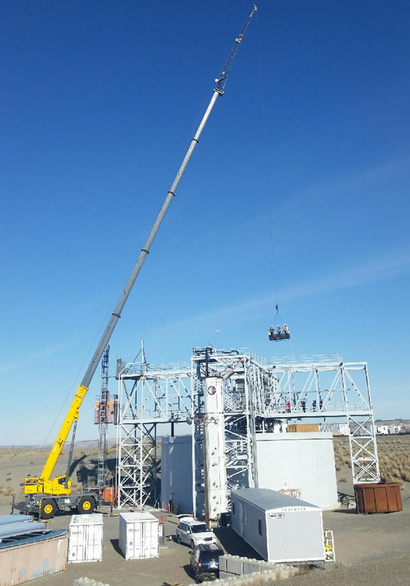 Mission Support Alliance crane operator David Nissen uses the 150-ton crane and a 256-foot extension to lift ironworkers and electricians to the work area at the Cold Test Facility.