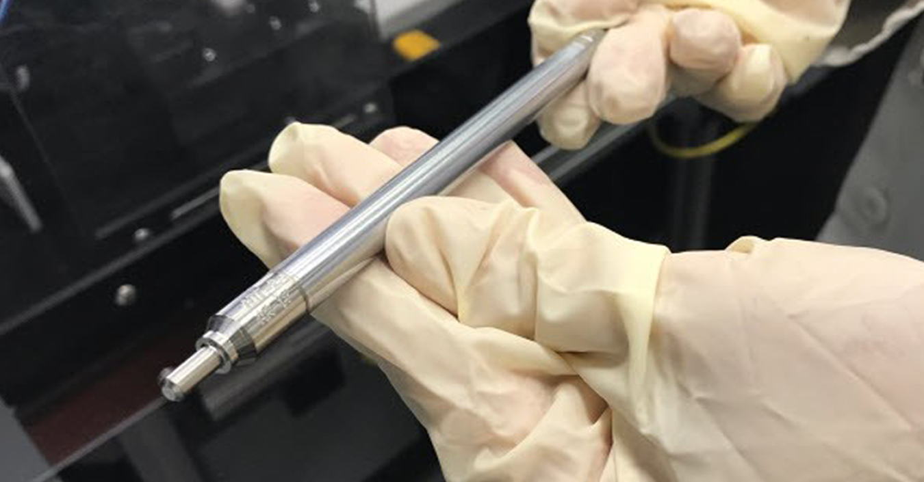 A researcher holds a nuclear fuel pin from Framtome.