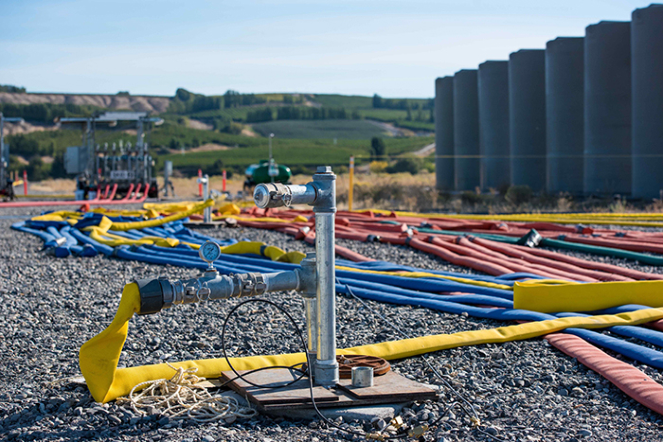 Surrounded by storage tanks and injection hoses, Pacific Northwest National Laboratory’s subsurface imaging technology monitors the delivery of a phosphate solution for binding contaminants in the soil at the Hanford Site’s 300 Area.