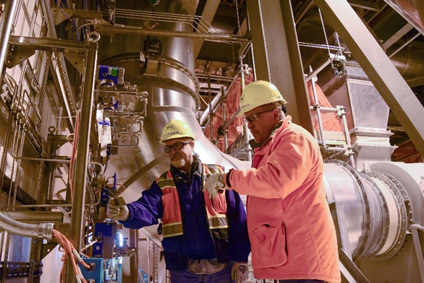 Employees at Hanford’s Waste Treatment and Immobilization Plant (WTP) inspect a system equipment tag inside the plant’s Analytical Laboratory.