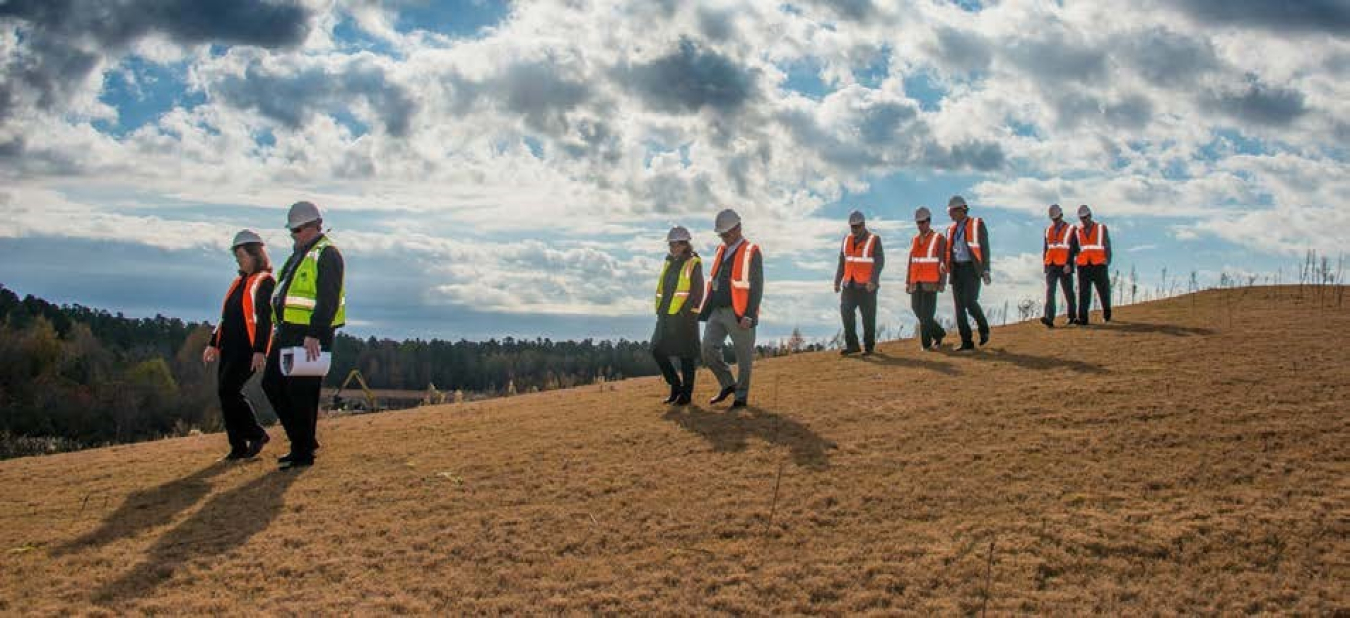 SRNS senior management and Board of Directors inspect a recently completed ash mound at SRS.