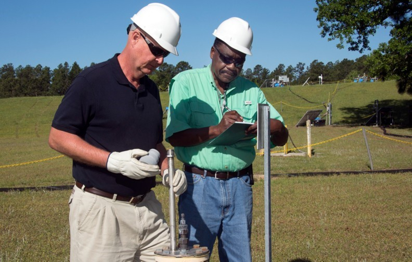 John Bradley, Design Authority Engineer (left) and Joao Cardoso-Neto, Upper Three Runs Project Manager, both with the SRNS Area Cleanup Projects organization, inspect a BaroBall™ unit.