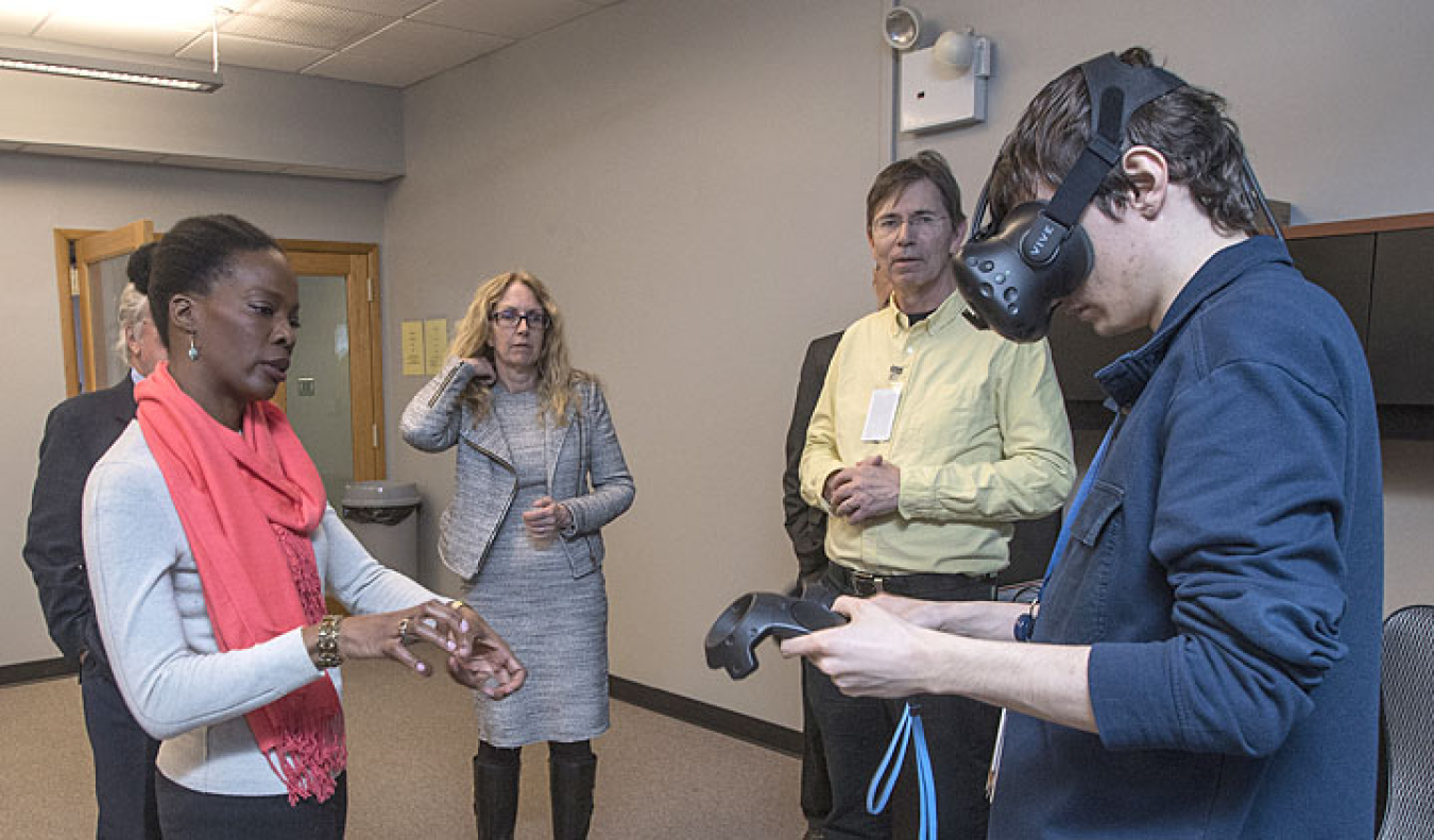 Raffaele Miceli demonstrates a virtual reality visualization to Danah Alexander, a senior project manager with Empire State Development, as Kerstin Kleese van Dam, director of Brookhaven Lab's Computational Science Initiative (CSI).